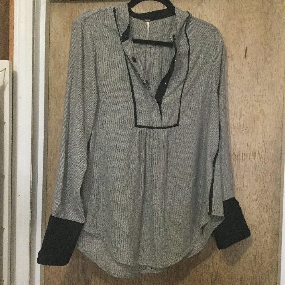 Free people blouse black & white striped size small will fit a medium